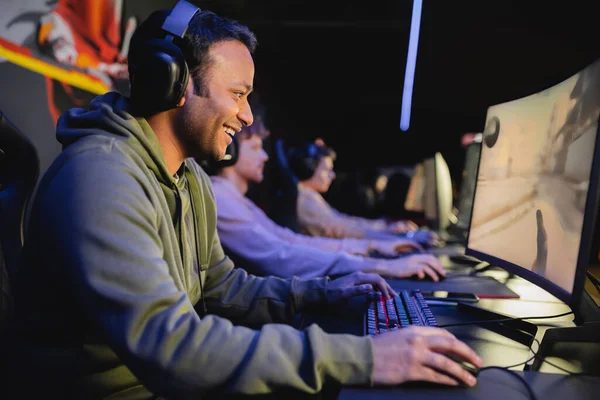 A smiling player at a front-seat station in the COMBO hit corner